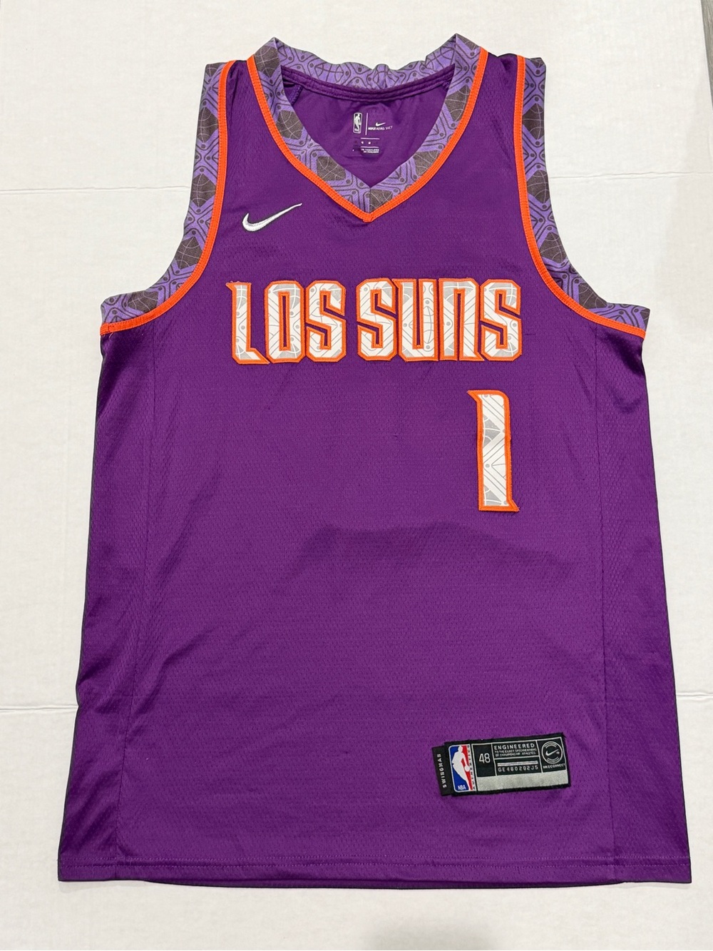 Nike Phoenix Suns Devin Booker 'LOS SUNS' purple jersey with orange trim